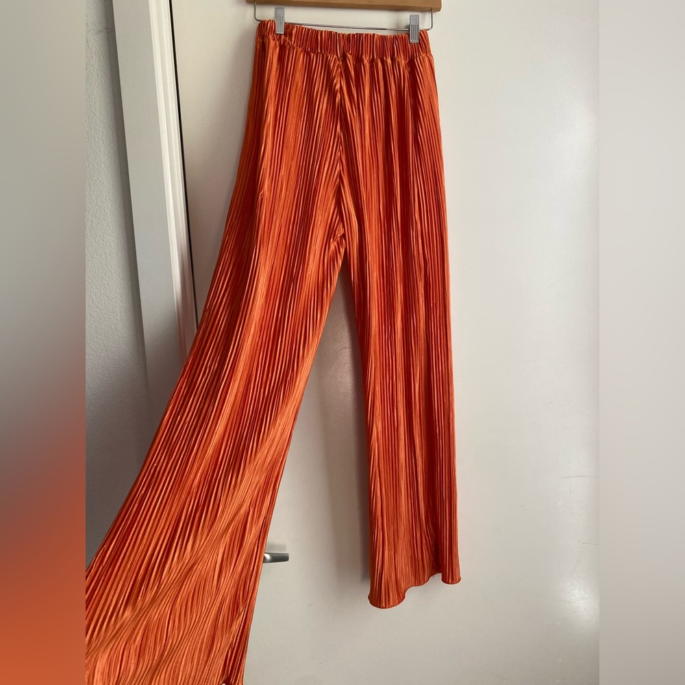 Gently worn orange flowy pants